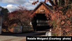 FILE - A covered bridge near Woodstock and Pomfret, Vermont during autumn.