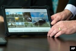 A screen displays categories of experiences that are offered for users of the Mynd Immersive virtual reality program, at John Knox Village, Wednesday, Jan. 31, 2024, in Pompano Beach, Fla. (AP Photo/Lynne Sladky)
