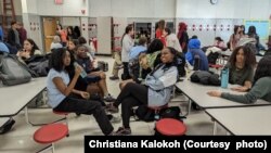 Christiana Kalokoh (middle, left) helps run her school's Bible study club.