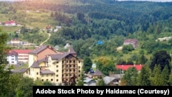 FILE - The village of Skhidnytsia among the Carpathian mountains seen here on April 27, 2021. (Adobe Stock Photo by Haidamac)
