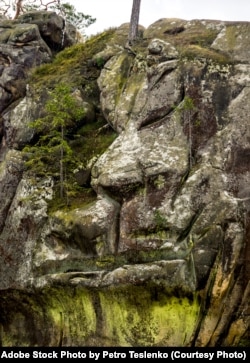 FILE - The artificial lion face in the rocks of Dovbush in the Ukrainian Carpathians. (Adobe Stock Photo)
