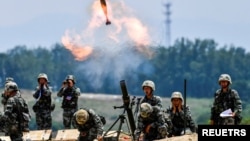 တရုတ်စစ်တပ် စစ်ရေးလေ့ကျင့်မှုမြင်ကွင်းတခု (REUTERS)