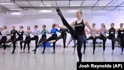 Amarisa LeBar, front, a Radio City Rockette, leads students in a Rockettes dance class Feb. 8, 2023, at the Boston Conservatory at Berklee. (AP Photo/Josh Reynolds)