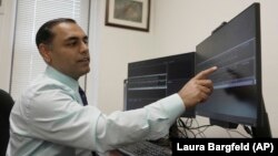 Dr. Roneil Malkani shows an example of pink noise being used to enhance slow brainwaves during deep sleep, May 16, 2024. (AP Photo/Laura Bargfeld)
