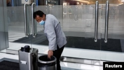 Cleaning worker Hu Dexi, 67, works at a shopping mall in Beijing, China April 10, 2024. (REUTERS/Tingshu Wang)