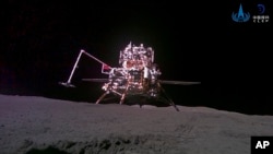 This China National Space Administration (CNSA) handout image released by Xinhua News Agency, shows the lander-ascender combination of Chang'e-6 probe taken by a mini rover after it landed on the moon surface, Tuesday, June 4, 2024. (CNSA/Xinhua via AP)