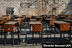FILE - The benches of a school sit empty in Kabul, Afghanistan, Thursday, Dec. 22, 2022. The country's Taliban rulers have banned girls from middle school, high school, and most jobs. Women are also banned from parks and gyms. (AP Photo/Ebrahim Noroozi)