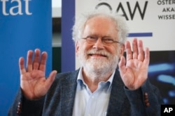 Professor Anton Zeilinger from the University of Vienna attends a news conference at the Institute for Quantum Optics and Quantum Information in Vienna, Austria, Tuesday, Oct. 4, 2022. (AP Photo/Theresa Wey)