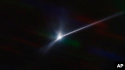 This image made available by NOIRLab shows a plume of dust and debris blasted from the surface of the asteroid Dimorphos by NASA's Dart spacecraft after it impacted on Sept. 26, 2022, captured by the U.S. National Science Foundation's NOIRLab's SOAR telescope in Chile. (Teddy Kareta, Matthew Knight/NOIRLab via AP)