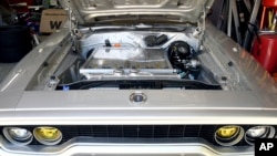 Kevin Erickson's electrified 1972 Plymouth Satellite is seen at his Commerce City, Colo., home on Sept. 20, 2022. Erickson is part of a small but expanding group converting vintage cars and trucks into greener, often much faster, electric vehicles. (AP Photo/Thomas Peipert)