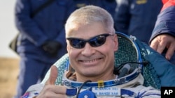 NASA astronaut Mark Vande Hei gives the thumbs up outside the Soyuz MS-19 spacecraft after he landed with Russian cosmonauts Anton Shkaplerov and Pyotr Dubrov in a remote area near the town of Zhezkazgan, Kazakhstan on March 30, 2022.