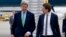U.S. Secretary of State John Kerry, left, walks to his car with Austria's Foreign Minister Sebastian Kurz, right, as he arrives at Vienna International Airport, in Vienna, Austria, Oct. 15, 2014. 