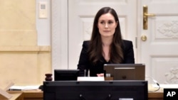 Prime Minister of Finland Sanna Marin, center, chairs her first government meeting in Helsinki, Finland on Tuesday Dec. 10, 2019. 