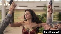 FILE - This image released by Warner Bros. Entertainment shows Gal Gadot in a scene from "Wonder Woman 1984." (Clay Enos/Warner Bros. Entertainment via AP)