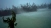 Strong winds from Hurricane Dorian blow the tops of trees and brush while whisking up water from the surface of a canal that leads to the sea, in Freeport, Grand Bahama, Bahamas, Sept. 2, 2019.