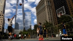 Emergency personnel gather at the entrance to a subway station in the Brooklyn borough of New York. Multiple people were shot and injured at the subway station during a morning rush hour attack.