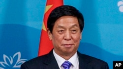 中共中央政治局委员栗战书在符拉迪沃斯托克会见俄罗斯总统普京。（2022年9月7日）