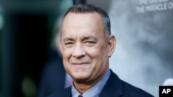 Tom Hanks bumped into a couple taking wedding photos in New York City.