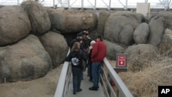 This Feb. 27, 2011 picture shows visitors touring the coastal fog desert area of the Biosphere 2 complex in Oracle, Ariz. (AP Photo/Allen Breed)