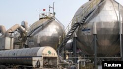 FILE - Carbon dioxide storage tanks are seen at a cement plant and carbon capture facility in Wuhu, Anhui province, China September 11, 2019. (REUTERS/David Stanway/File Photo)