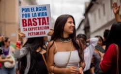 In this March 8, 2020 photo provided by Lucas Bustamante, Helena Gualinga marches in the International Women's March in Quito, Ecuador.