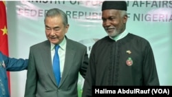 中国外交部长王毅在尼日利亚首都阿布贾与尼日利亚外长图加尔举行会晤。(2025年1月9日)