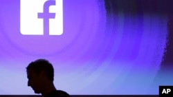 In this April 4, 2013, file photo, Facebook CEO Mark Zuckerberg walks at the company's headquarters in Menlo Park, Calif. (AP Photo/Marcio Jose Sanchez, File)