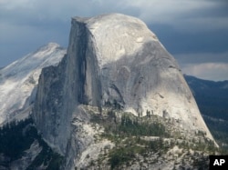 Half Dome and Yosemite Valley in a view from Glacier Point at Yosemite National Park, California