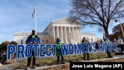 Abortion rights supporters demonstrate in front of the U.S. Supreme Court on December 1, 2021, in Washington. (AP Photo/Jose Luis Magana)