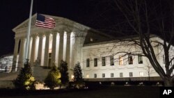 A U.S. flag flies at half-staff in front of the U.S. Supreme Court in Washington, Feb. 13, 2016, after it was announced that Supreme Court Justice Antonin Scalia, 79, had died. (AP Photo/J. David Ake)