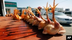 In this Tuesday Jan. 21, 2014, file photo, slaughtered chickens are displayed for sale at a wholesale poultry market in Shanghai. (AP Photo, File)