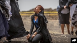 Ethiopian relatives of crash victims mourn at the scene where the Ethiopian Airlines Boeing 737 Max 8 crashed shortly after takeoff Sunday, killing all 157 on board, near Bishoftu, south-east of Addis Ababa, in Ethiopia Thursday, March 14, 2019. (AP Photo)