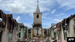 Amnesty International နိုင်ငံတကာ လွတ်ငြိမ်းချမ်းသာခွင့် အဖွဲ့က ၂၀၂၂ ခုနှစ် ဇူလိုင်လတုန်းက ထုတ်ပြန်တဲ့ ဓာတ်ပုံထဲမှာ ကရင်နီ ခေါ် ကယားပြည်နယ် ဖရူဆိုမြို့က ခရစ်ယာန် ဘုရားကျောင်း ပျက်စီးနေတဲ့ မြင်ကွင်း။ ဓာတ်ပုံ - Handout / Amnesty International / AFP 