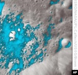 Water-rich minerals (light blue) are shown around a small crater on the far side of the Moon. (AP/Photo)