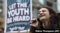 In this Monday, Oct. 29, 2018 file photo, Jamie Margolin, a high school student, speaks during a rally by youth activists and others in Seattle in support of a high-profile climate change lawsuit in federal court in Eugene, Oregon. (AP Photo/Elaine Thompson)