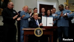 U.S. President Donald Trump is after signing a proclamation to establish tariffs on imports of steel and aluminum at the White House in Washington, March 8, 2018.