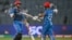 Afghanistan's Azmatullah Omarzai (L) celebrates with his captain Hashmatullah Shahidi after scoring a half-century (50 runs) during the 2023 ICC Men's Cricket World Cup one-day international (ODI) match between Afghanistan and Sri Lanka at the Maharashtra