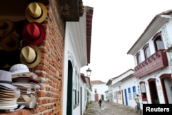 Hats are displayed in a hat shop in Paraty, Brazil September 20, 2018. REUTERS/Sergio Moraes