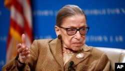 FILE - In this Feb. 10, 2020, file photo U.S. Supreme Court Associate Justice Ruth Bader Ginsburg speaks during a discussion on the 100th anniversary of the ratification of the 19th Amendment at Georgetown University Law Center in Washington. (AP…