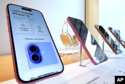 FEil - This is a display of iPhone 16s in an Apple Store in Pittsburgh on Jan. 12, 2025. (AP Photo/Gene J. Puskar)