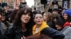Actresses Asia Argento, left, and Rose McGowan pose during a demonstration to mark International Women's Day in Rome, March 8, 2018. Asia Argento, an Italian actress who helped launch the #MeToo movement, is launching a new movement, #WeToo, which aims to