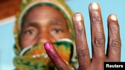 FILE: Zimbabwean Woman Votes