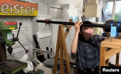 Yuna Kato works with her college club to produce a light human-powered aircraft at Tokyo University in Tokyo, Japan, on July 3, 2023, in this screen grab from video. (REUTERS/Chris Gallagher)