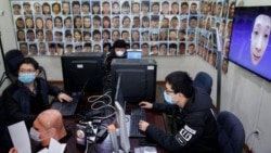 Software engineers work on a facial recognition system that identifies people when they wear a face mask at the development lab of the Chinese electronics manufacturer Hanwang.