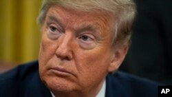 Le président Donald Trump, dans le bureau ovale de la Maison-Blanche, le mardi 26 novembre 2019 à Washington. (Photo AP / 