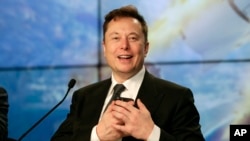 Elon Musk founder, CEO, and chief engineer/designer of SpaceX speaks during a news conference after a Falcon 9 SpaceX rocket test flight to demonstrate the capsule's emergency escape system at the Kennedy Space Center in Cape Canaveral, Fla., Sunday, Jan.
