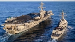 资料照片：美国海军“西奥多·罗斯福”号航空母舰与“卡尔·M·莱文”号驱逐舰在太平洋准备加油。(2025年11月16日)