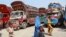 FILE - Afghan refugees living in Pakistan arrive at the UNHCR's Repatriation Center en route to Afghanistan, in Peshawar, Pakistan.