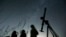 FILE - People look up to the sky from an observatory near the village of Avren, Bulgaria, Aug. 12, 2009. (AP Photo/Petar Petrov, File)