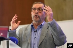French physicist Alain Aspect speaks during a press conference, Tuesday, Oct. 4, 2022 in Palaiseau, outside Paris. (AP Photo/Michel Euler)